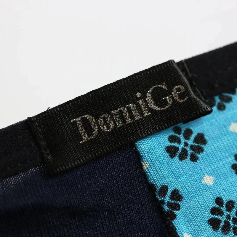 DomiGe logo waistband close-up — modal T-back thong Blue
