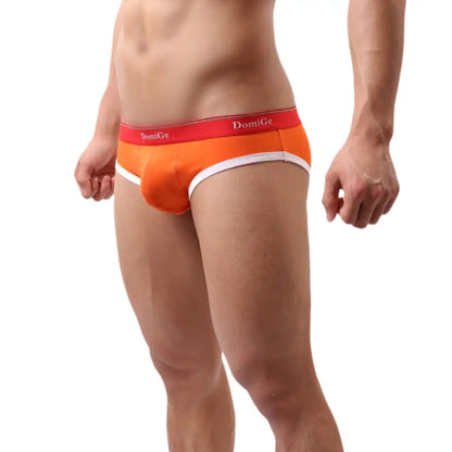 DomiGe low-rise modal briefs front view — red and white logo waistband u-pouch Orange