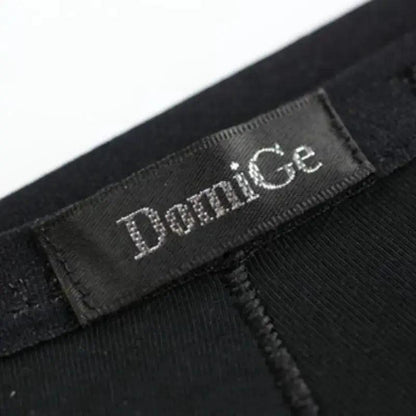 Embossed logo elastic waistband close-up — modal low-rise briefs DomiGe black