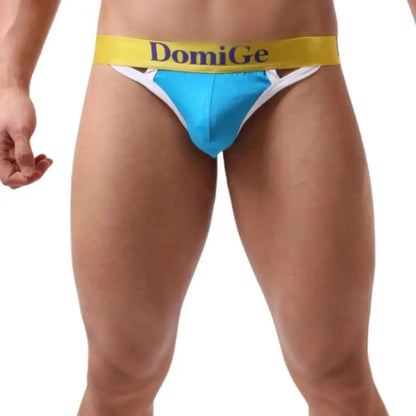 Model wearing DomiGe T-back — single T-strap front view blue