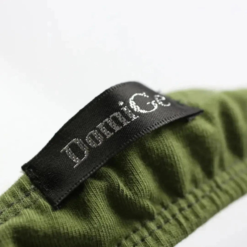 Side personality strap detail close-up — cotton thong bold seductive design DomiGe Army Green
