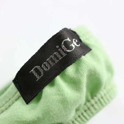 Side personality strap detail close-up — cotton thong bold seductive design DomiGe Bright Green