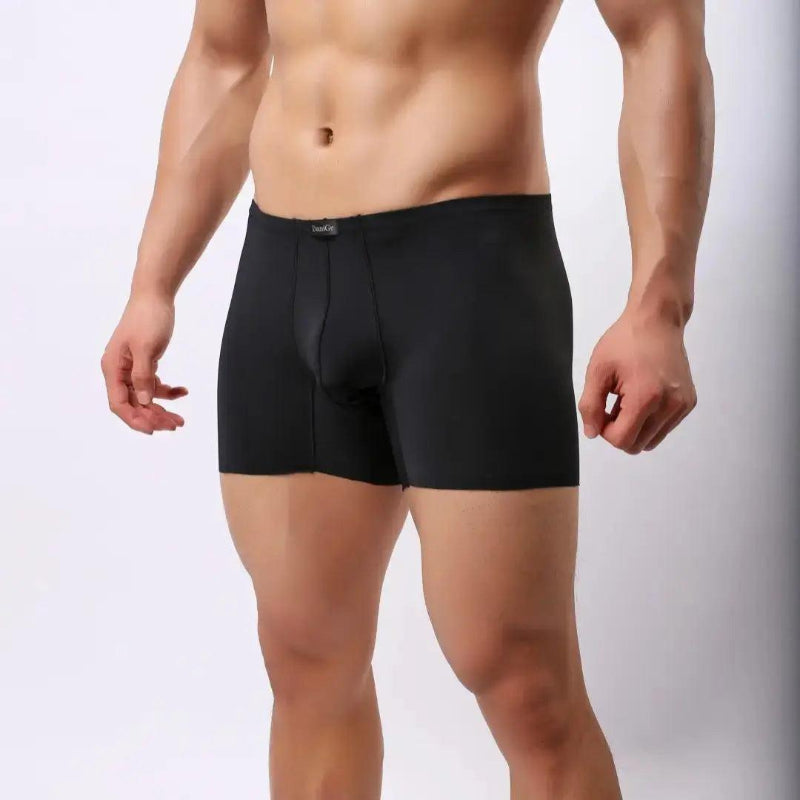 DomiGe laser-cut boxer shorts black side view — relaxed loose-fit profile seamless legs model	