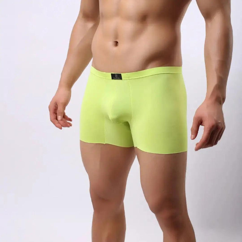 DomiGe laser-cut boxer shorts bright green side view — relaxed loose-fit profile seamless legs model	
