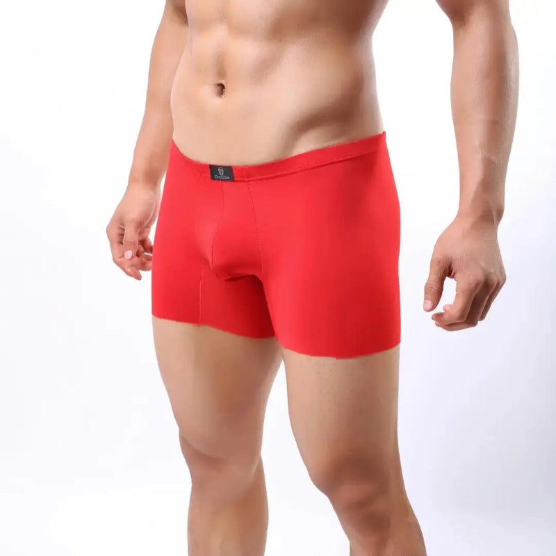 DomiGe laser-cut boxer shorts red side view — relaxed loose-fit profile seamless legs model	