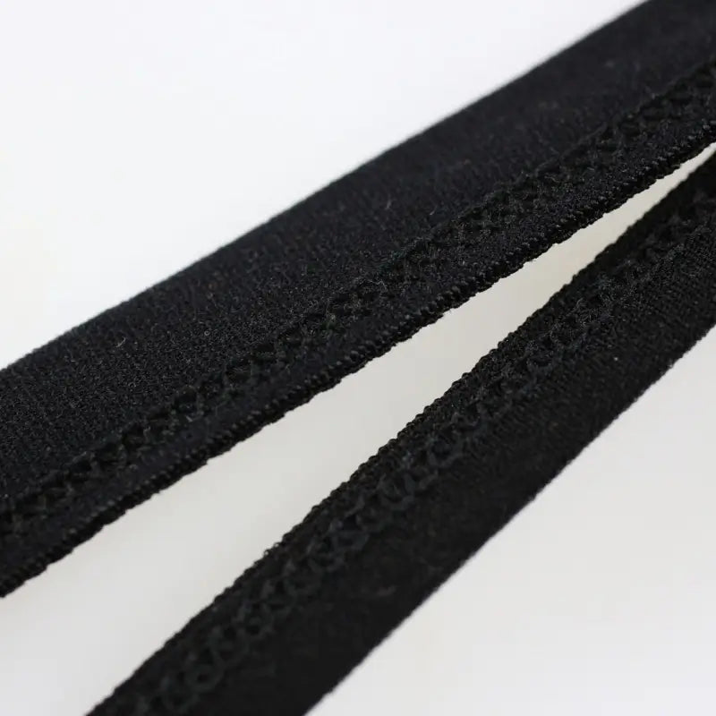 DomiGe hollow-design bikini brief black fabric texture close-up — stretch microfiber breathable	