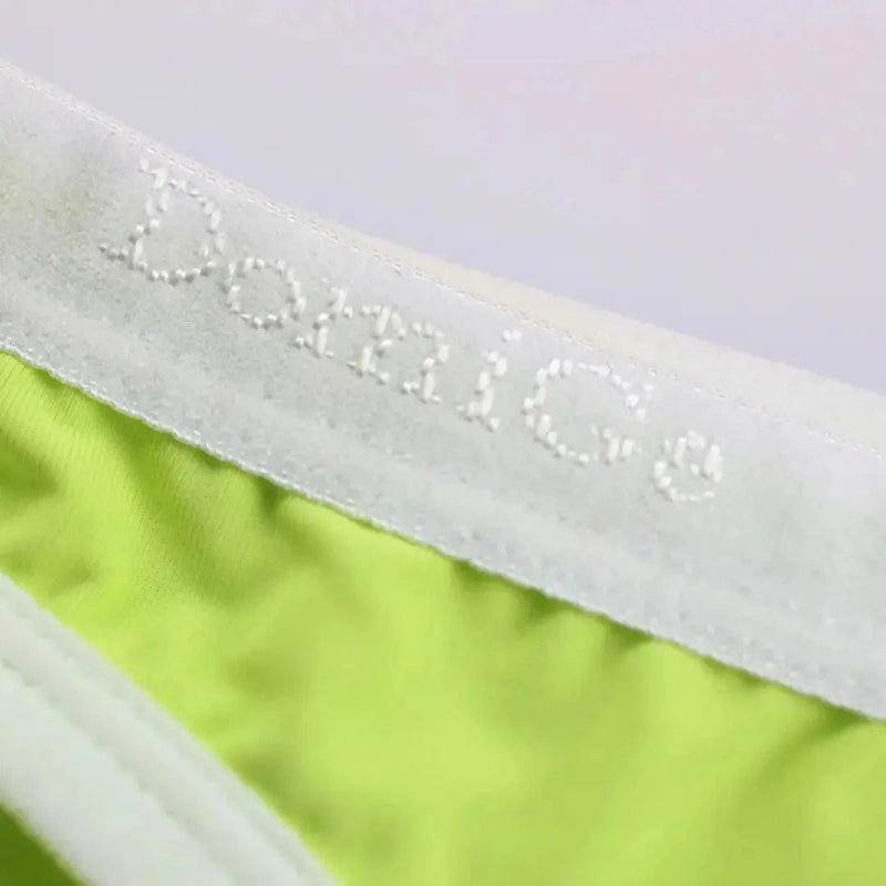 Ice silk nylon fabric texture close-up bright green — cooling moisture-wicking briefs DomiGe	