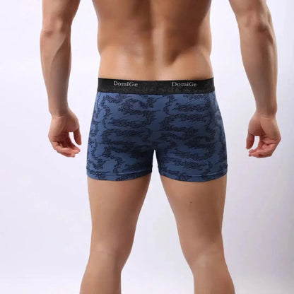 Rear view of men's bamboo fiber boxer briefs in cobalt blue print — DomiGe seamless one-piece rear with no center seam	