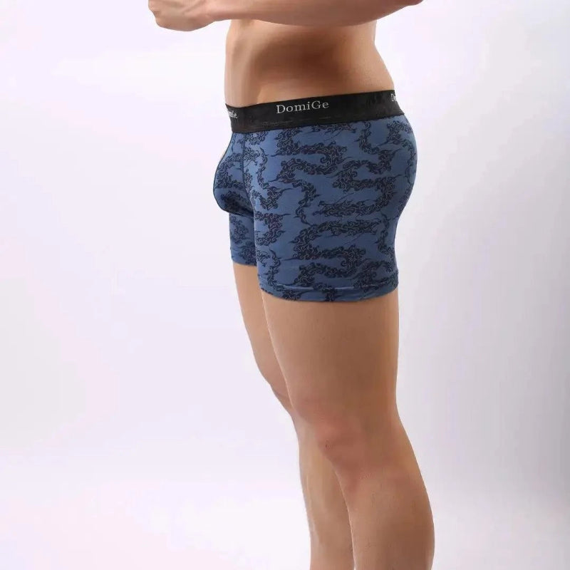 Side view of men's bamboo boxer briefs in cobalt blue print — DomiGe mid-rise fit with seamless leg opening	