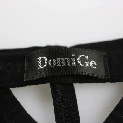 DomiGe bamboo T-back thong in black — flat lay side showing T-back strap and fabric texture	