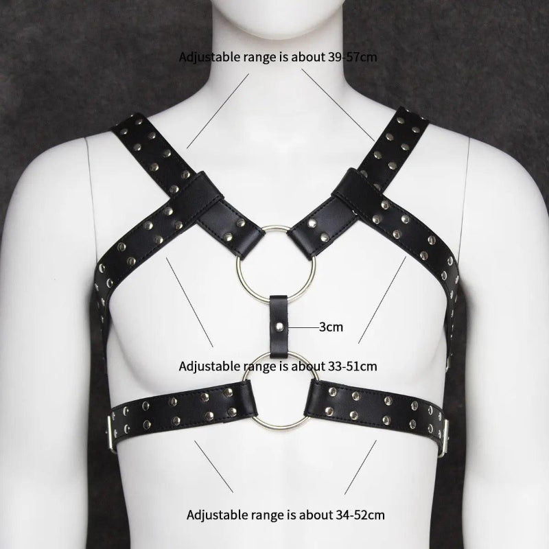 DomiGe black PU leather body harness — close-up product detail showing leather texture and metal hardware	