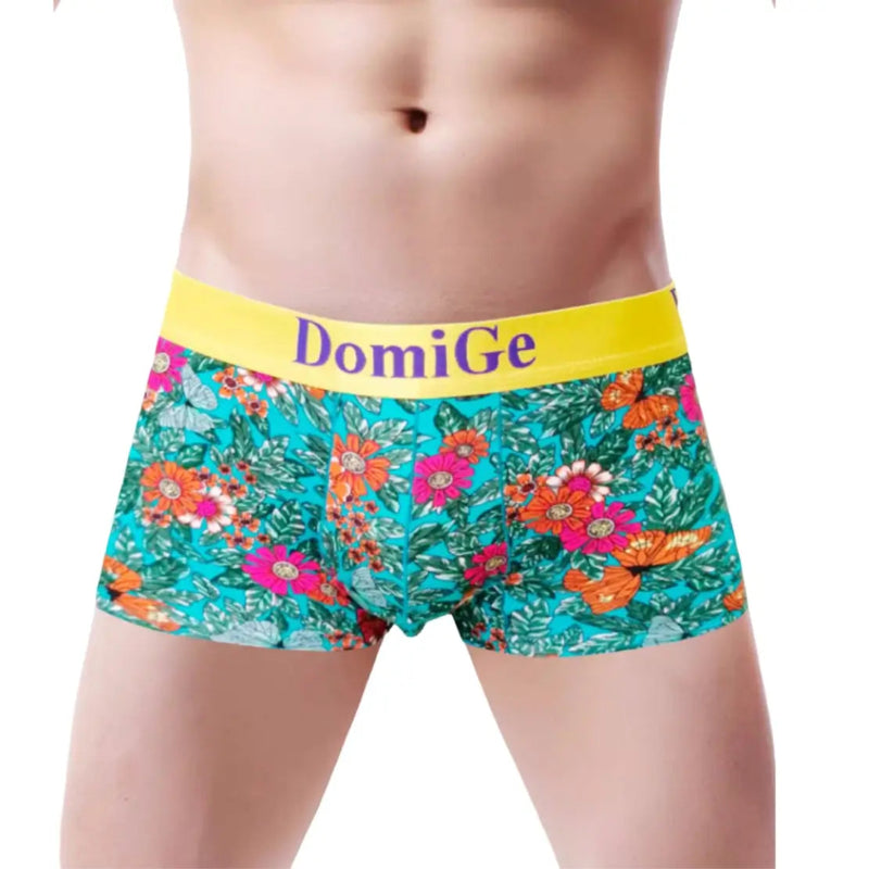 DomiGe men's blue floral print boxer briefs front view — 3D contoured pouch, 3.5cm yellow waistband with blue logo	