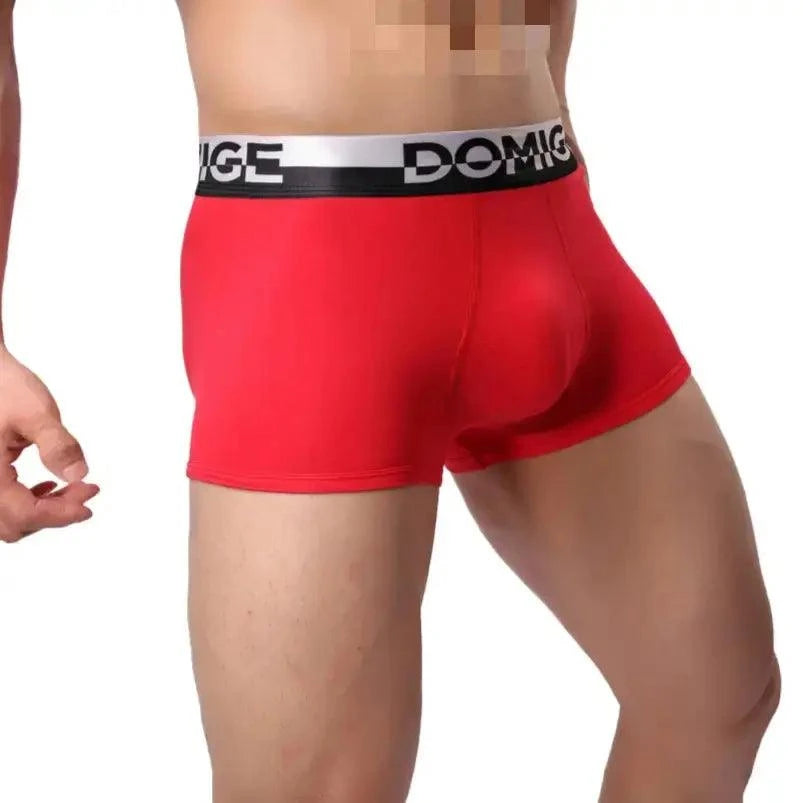 DomiGe cotton boxer briefs turtle shell pouch in red — model side view showing silver logo waistband and leg fit	