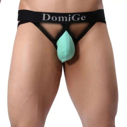 DomiGe cotton lycra jockstrap in light green — model side view showing W-shape back and silver logo waistband	