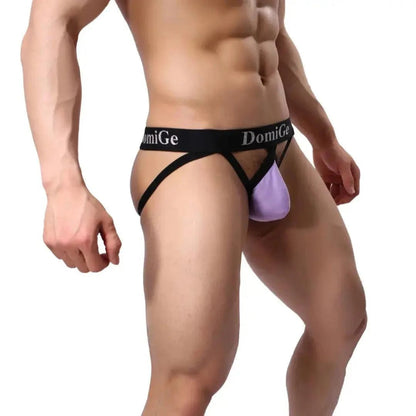DomiGe cotton lycra jockstrap in purple — model side view showing W-shape back and silver logo waistband	