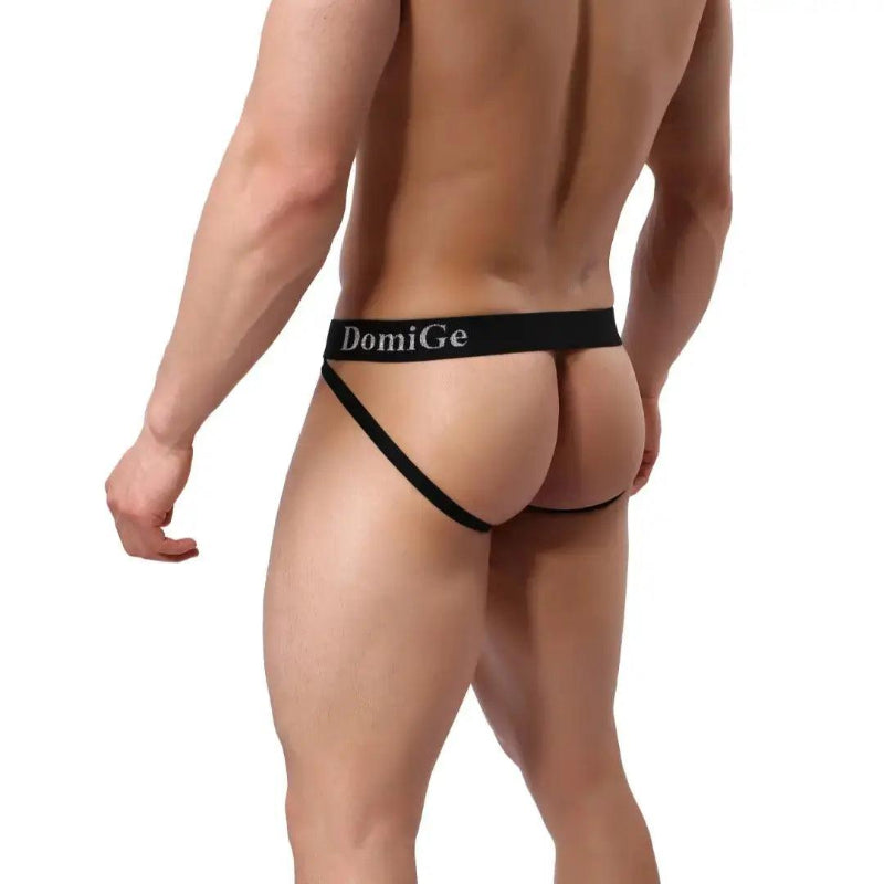 DomiGe cotton lycra jockstrap in red — model rear view showing W-shape cross-strap design	
