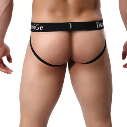 DomiGe cotton lycra jockstrap in sky blue — model rear view showing W-shape cross-strap design	