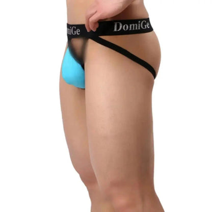 DomiGe cotton lycra jockstrap in sky blue — model side view showing W-shape back and silver logo waistband	