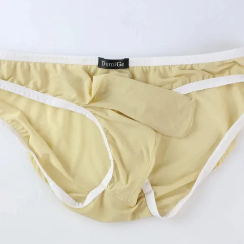 DomiGe elephant cock sock briefs in apricot — flat lay front view showing elephant trunk pouch design	