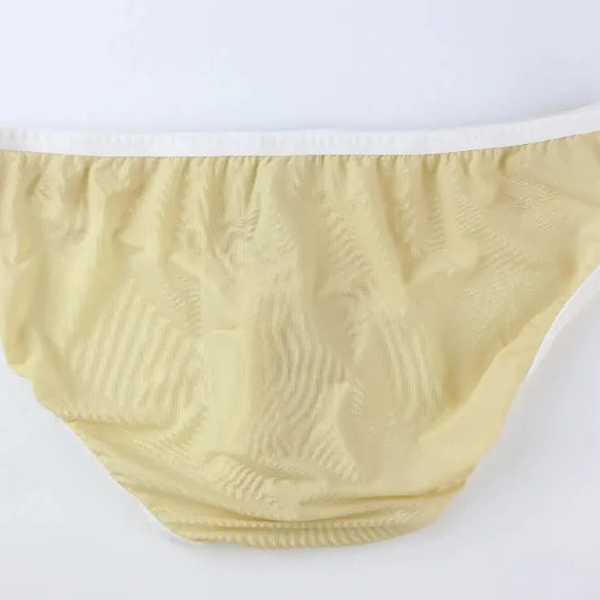 DomiGe elephant cock sock briefs in apricot — flat lay side view showing contoured pouch and waistband	