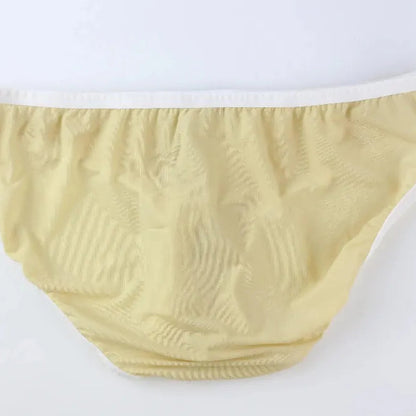 DomiGe elephant cock sock briefs in apricot — flat lay side view showing contoured pouch and waistband	