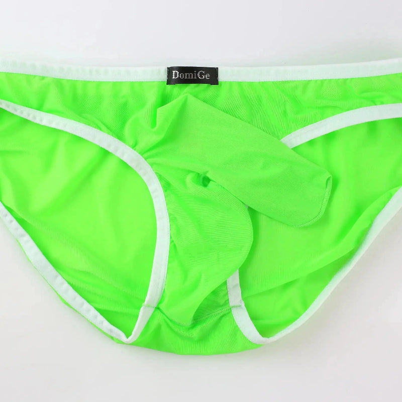 DomiGe elephant cock sock briefs in bright green — flat lay front view showing elephant trunk pouch design	