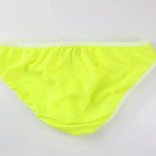 DomiGe elephant cock sock briefs in light green — flat lay side view showing contoured pouch and waistband	