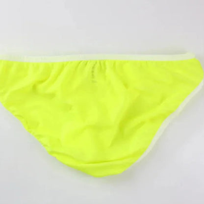 DomiGe elephant cock sock briefs in light green — flat lay side view showing contoured pouch and waistband	