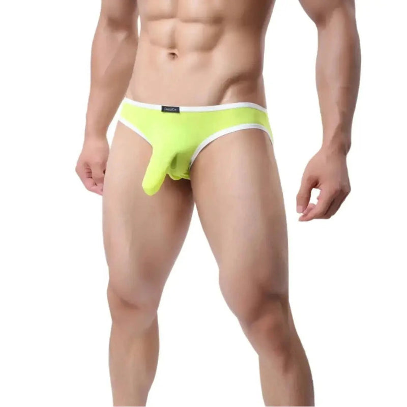 DomiGe elephant cock sock pouch briefs in light green — model side view showing low-rise fit and contoured pouch	