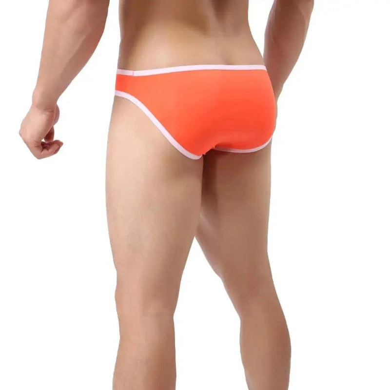 DomiGe elephant cock sock pouch briefs in orange — model rear view showing full back coverage	