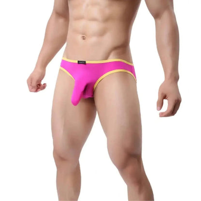 DomiGe elephant cock sock pouch briefs in rose red — model side view showing low-rise fit and contoured pouch	