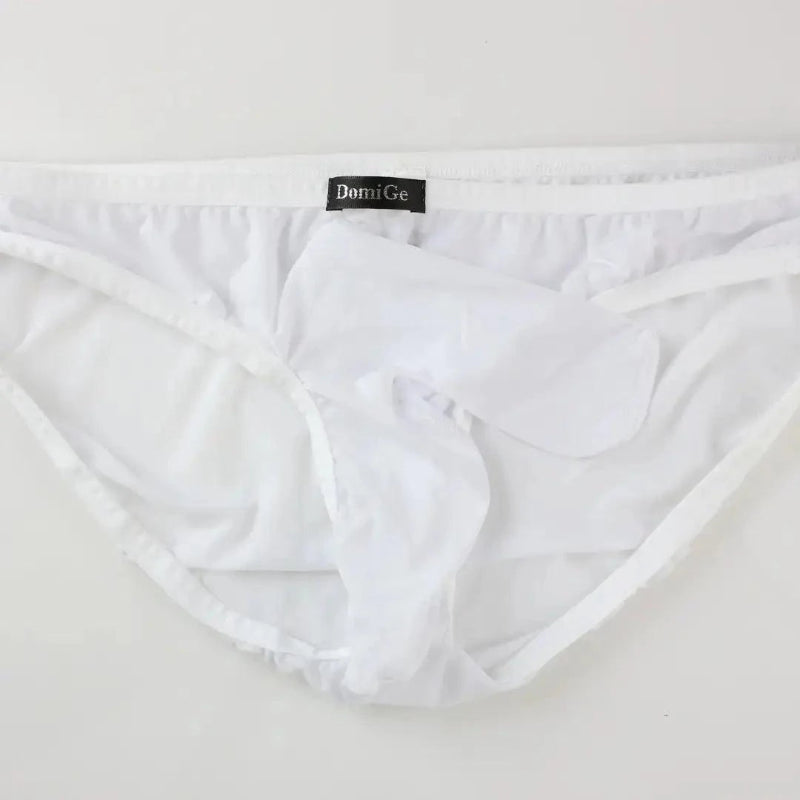 DomiGe elephant cock sock briefs in white — flat lay front view showing elephant trunk pouch design	