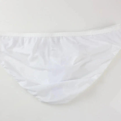 DomiGe elephant cock sock briefs in white — flat lay side view showing contoured pouch and waistband	