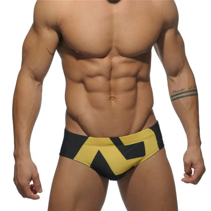 DomiGe fashion swim briefs in black — model front view	