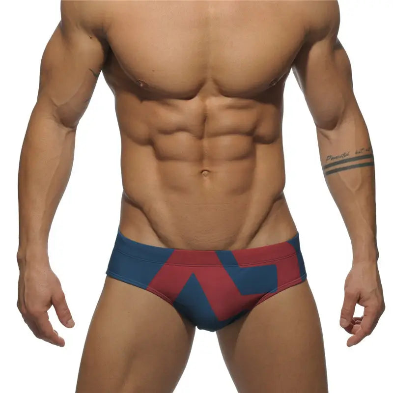 DomiGe fashion swim briefs in navy — model front view	