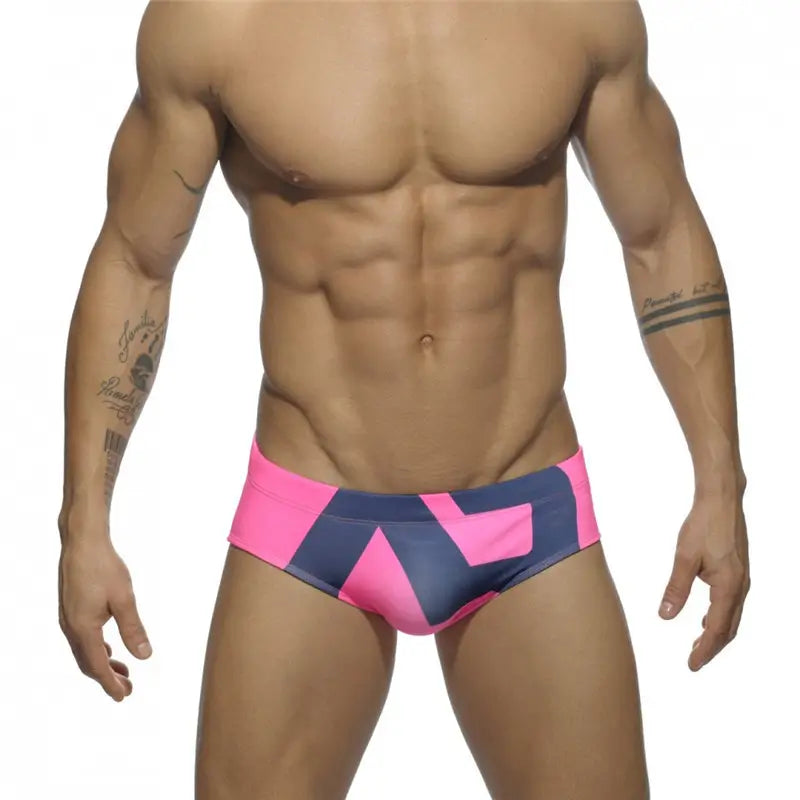 DomiGe fashion swim briefs in pink — model front view	