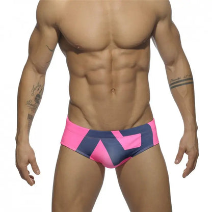 DomiGe fashion swim briefs in pink — model front view	