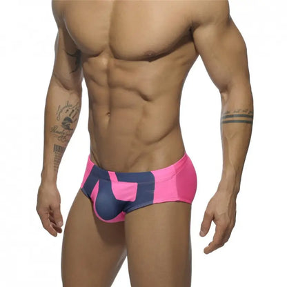 DomiGe fashion swim briefs in pink — model side view	