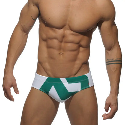 DomiGe fashion swim briefs in white — model front view	