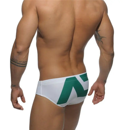 DomiGe fashion swim briefs in white — model rear view	