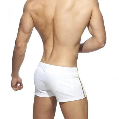DomiGe faux leather swim boxers in white — model rear view	
