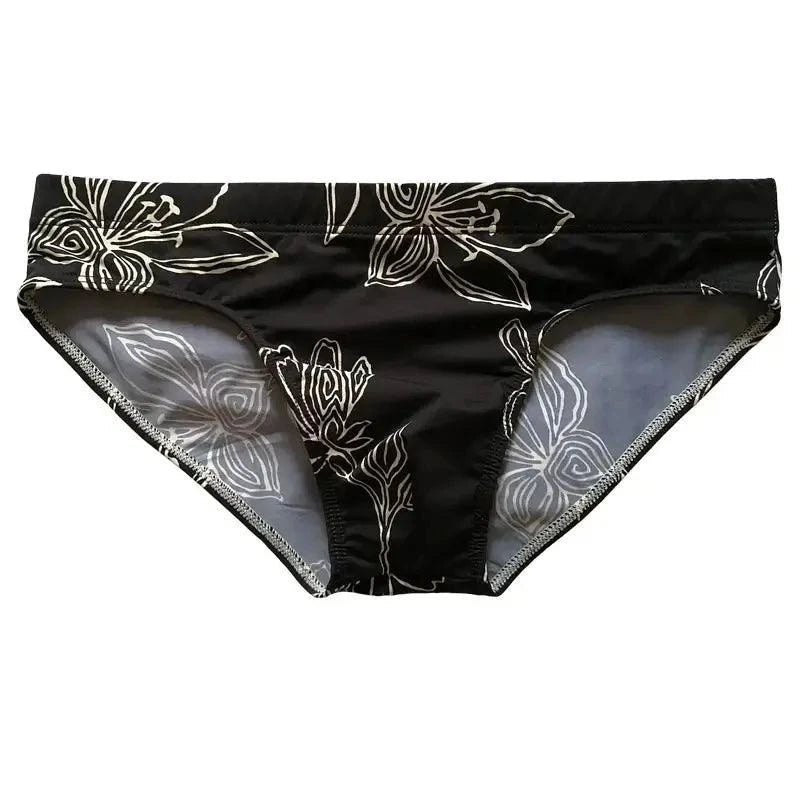 DomiGe white floral swim briefs — close-up floral print detail	