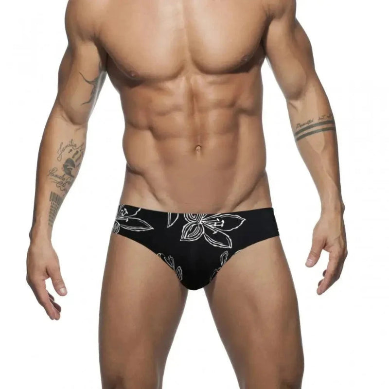 DomiGe white floral swim briefs — model front view	