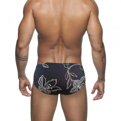 DomiGe white floral swim briefs — model rear view	