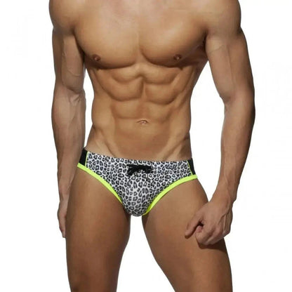DomiGe leopard print swim briefs in gray — model front view	
