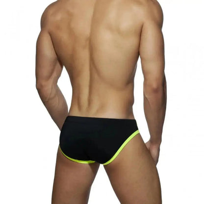 DomiGe leopard print swim briefs in gray — model rear view	