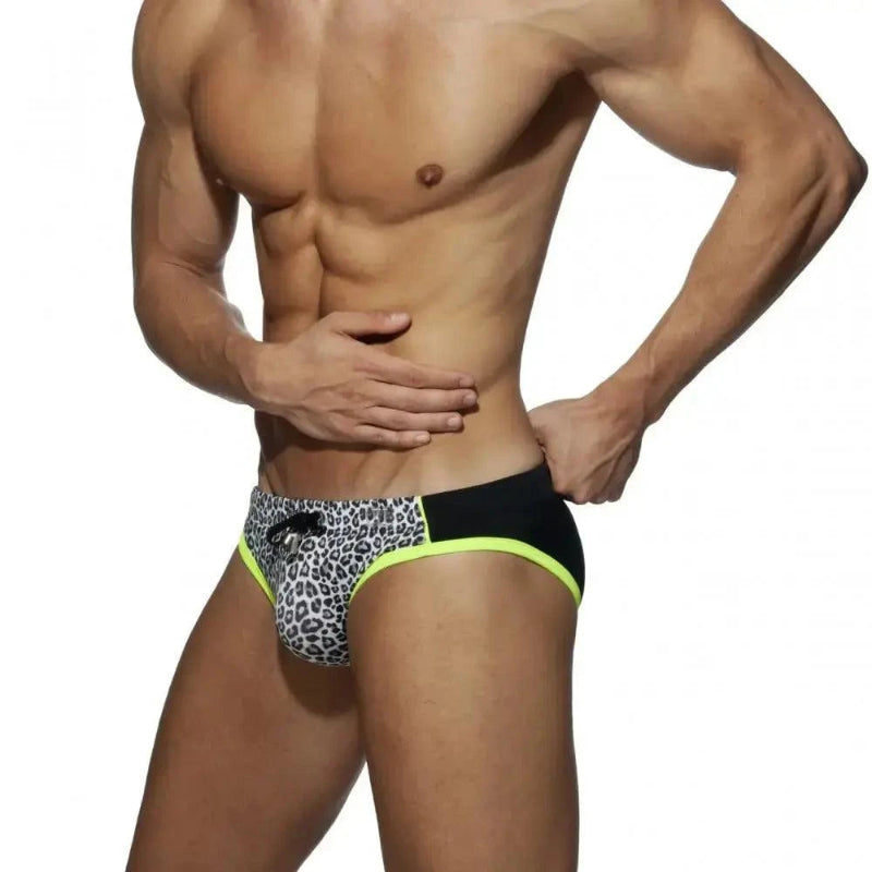 DomiGe leopard print swim briefs in gray — model side view	