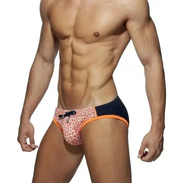 DomiGe leopard print swim briefs in orange — model side view	