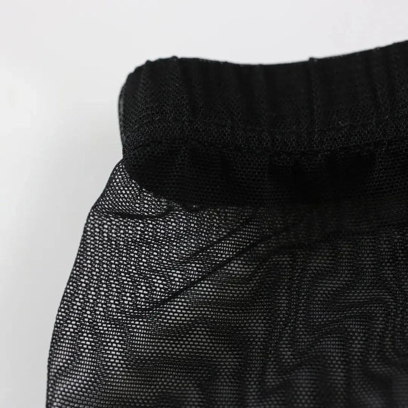 Detail of DomiGe modal mesh boxer briefs in black — breathable nylon mesh texture with ultra-soft modal lining	