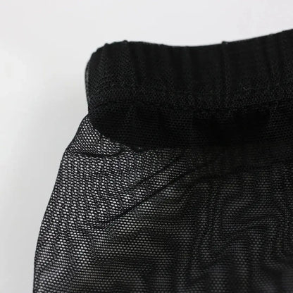 Detail of DomiGe modal mesh boxer briefs in black — breathable nylon mesh texture with ultra-soft modal lining	